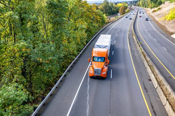 Truck on highway at sunset