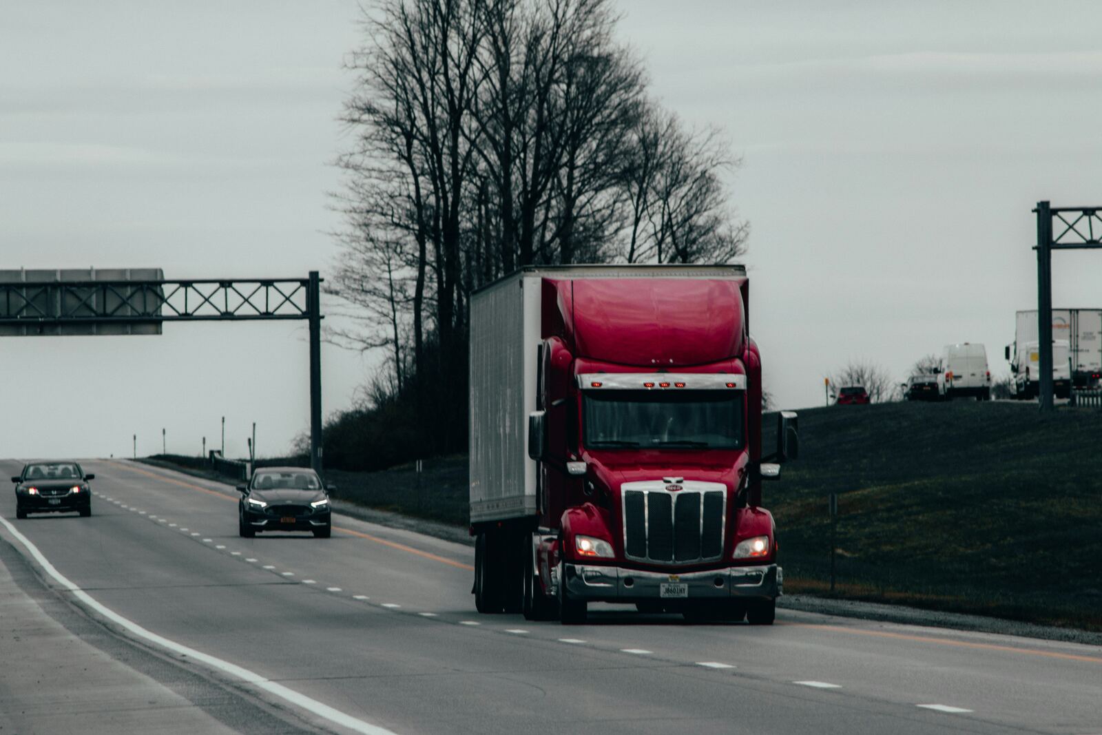 Semi truck on highway at sunset